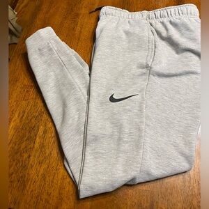 Nike dri fit fleece tapered track pants. Grey.  Size small.